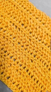 Knitting patterns for sweaters, hats, and other items using light-colored yar Фото