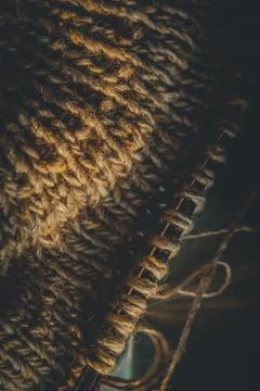 Knitting project close-up. Loops of yarn on the spokes. Knitting a warm sweater Stock Photos