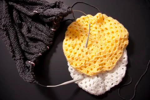 Knitting projects of blanket and two winter hats Stock Photos