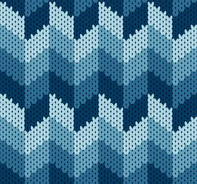 Knitting seamless pattern with a zigzag motif in various shades of blue Stock Illustration