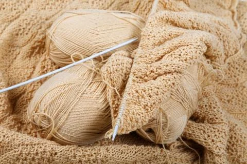 Knitting spokes with ball of wool on table Stock Photos