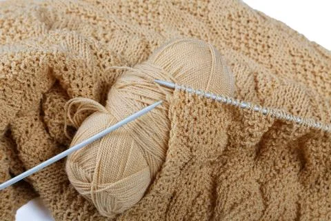Knitting spokes with ball of wool on table Stock Photos