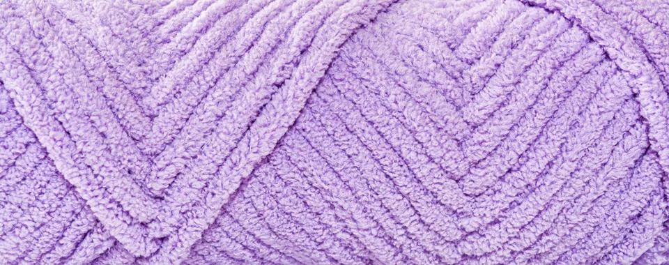 Knitting threads wound with a pattern in the form of arrows. Close-up design  Stock Photos