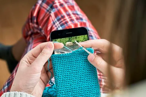 Knitting a woolen smartphone case Stock Photos