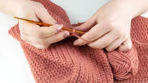 Knitting of woolen threads.Hook number three.Handicraft and clothing making. Stock-Footage 139087351