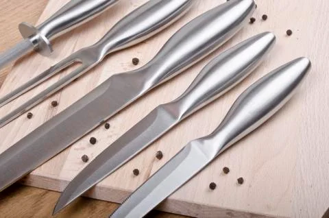 Knives with pepper Stock Photos