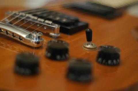 Knobs and buttons - Closeup shot of Washburn Idol WI-64 electric guitar with Stock Photos