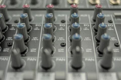 Knobs of an audio mixing table in the equalization and panning section Stock Photos