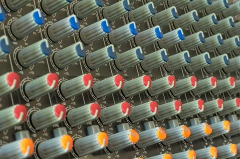 Knobs of a compact audio mixer Stock Photos