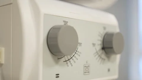 Knobs on dosimeter control panel twist under user fingers 스톡 동영상 312407742