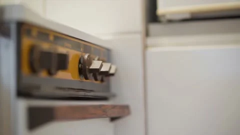 Knobs on an electric stove being turned on and off 動画素材 238745441