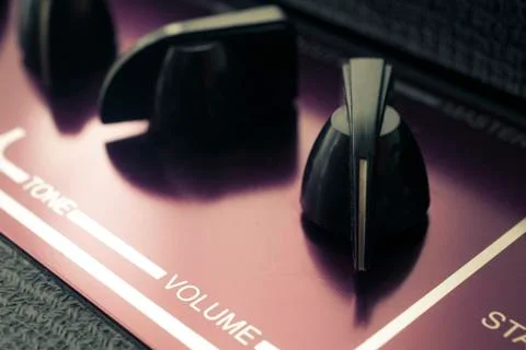 Knobs on a retro guitar amplifier Stock Photos