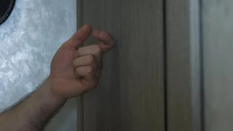 Knocking on the door with a man's hand. Knocking on a wooden door with a finger Stock Footage 336466332
