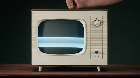 Knocking on old television with grey interference screen on black background Stock Footage 170142334
