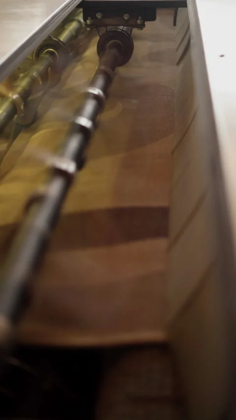 Knocking out carpets in a dust-beating machine in production Stock Footage 267691931