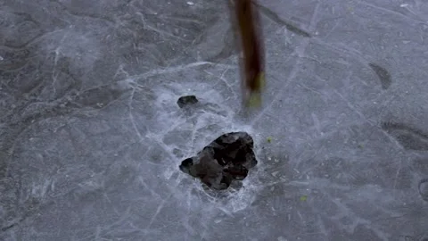 Knocking out ice in the cold. Stock Footage 230407973