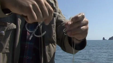 Knot on a fishing hook 스톡 동영상 52481968
