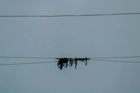 Knot hanging on a string on a rainy day Stock Photos