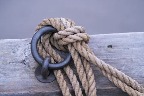 Knot on a metal ring Stock Photos