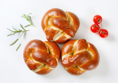 Knot shaped dinner rolls Stock Photos