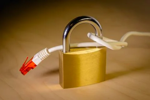 Knotted net cable around a padlock Stock Photos