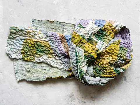Knotted patchwork scarf sewn from silk fabrics Stock-Fotos