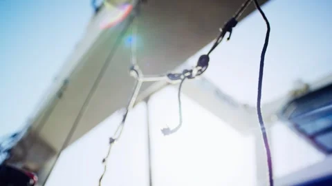 Knotted Ropes Hanging in Backlight, Boat Crane Silhouette, Soft Focus Detail Stock Footage 340333504