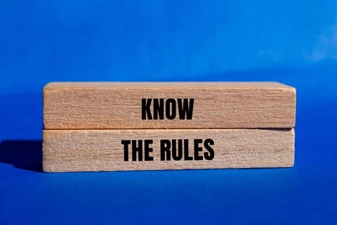 Know the rules message written on wooden blocks with blue background. Concept Stock-Fotos