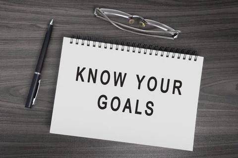 Know your goals text on notepad with pen, notepad and reading glasses. Stock Photos