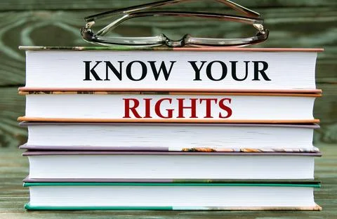 KNOW YOUR RIGHTS - words are written on books on a dark background Stock Photos