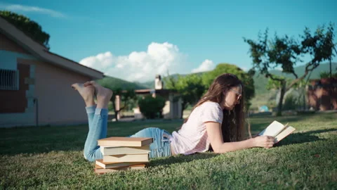 Knowledge and education concept, pensive woman reading book outdoors Video stock 139583565