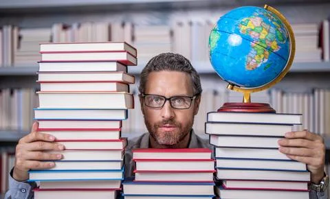 Knowledge and education concept. school teacher with book in classroom. teacher Stock Photos