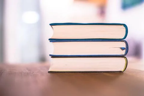 Knowledge and science concept: Stack of books lying on wooden desk, home. ... Stock Photos