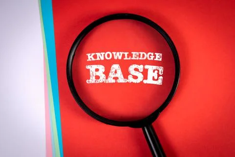 Knowledge base. Search and research concept. Magnifying glass on a red Stock Photos