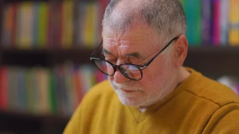 Knowledge Gazer Front View of Senior Man Amid Library Stacks Stock Footage 274288527