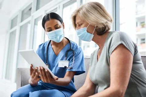 Knowledge makes a difficult process much more easier. a young doctor using a Stock Photos