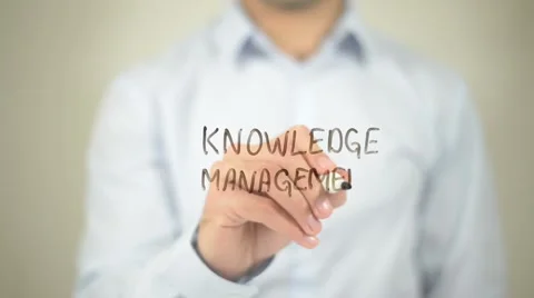 Knowledge Management   ,  man writing on transparent wall Stock Footage 62634488