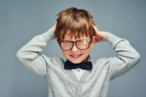 Knowledge overload. Studio portrait of an adorable little boy dressed smartly Stock Photos