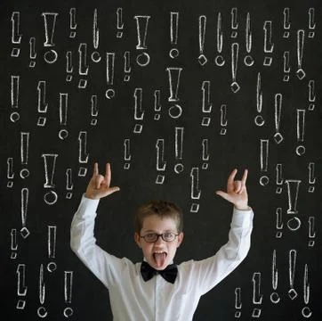 Knowledge rocks boy business man with chalk exclamation marks Stock Photos