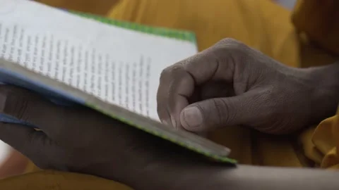 Knowledge, studying and wisdom concept.  Indian man readying a book Stock Footage 229848801