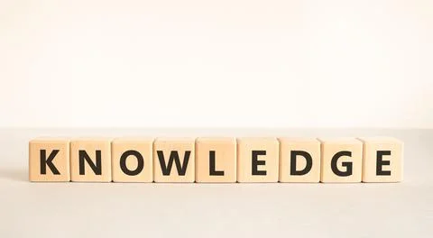Knowledge symbol. Concept word Knowledge on beautiful wooden blocks. Beauti.. Stock Photos