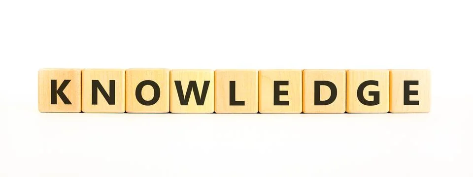 Knowledge symbol. Concept word Knowledge on beautiful wooden blocks. Beauti.. Stock Photos