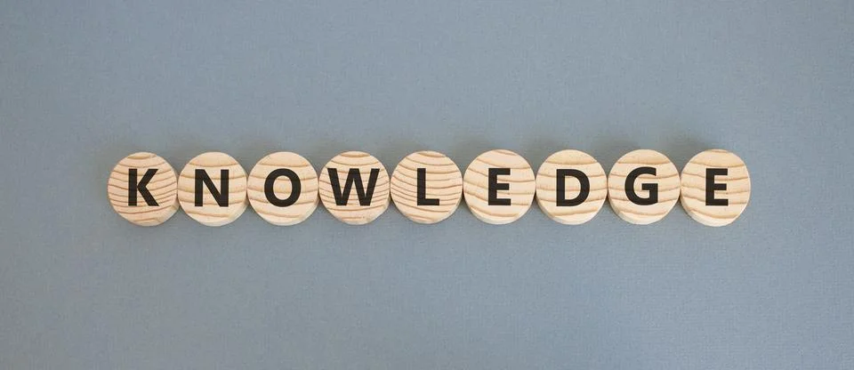 Knowledge symbol. Concept word Knowledge on beautiful wooden circles. Beaut.. Stock Photos