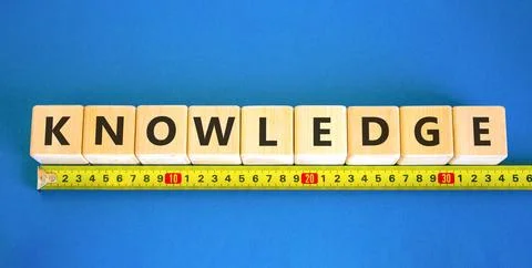 Knowledge symbol. Concept word Knowledge on beautiful wooden blocks. Beauti.. Stock Photos