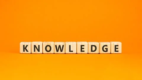 Knowledge symbol. Concept word Knowledge on beautiful wooden blocks. Beauti.. Stock Photos