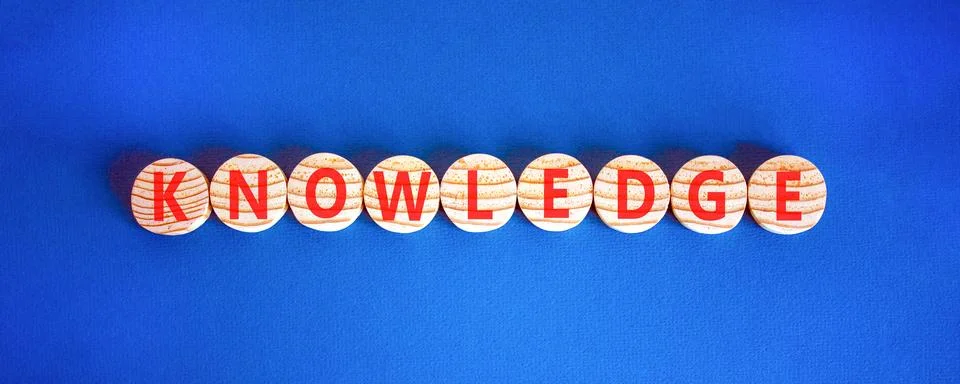 Knowledge symbol. Concept word Knowledge on beautiful wooden circles. Beaut.. Stock Photos