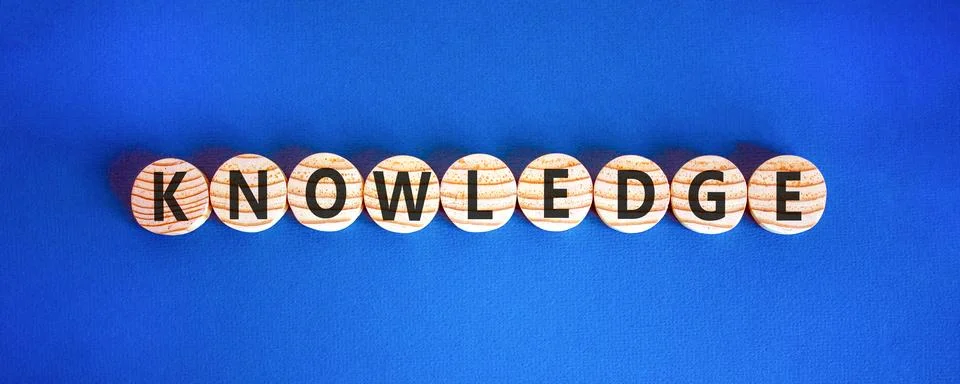 Knowledge symbol. Concept word Knowledge on beautiful wooden circles. Beaut.. Stock Photos