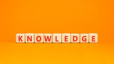 Knowledge symbol. Concept word Knowledge on beautiful wooden blocks. Beauti.. Stock Photos