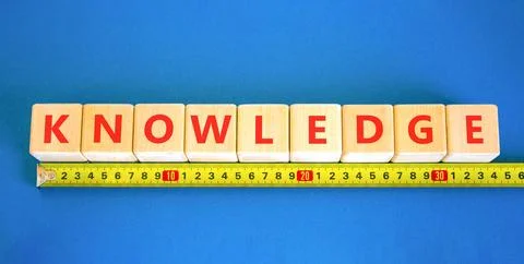 Knowledge symbol. Concept word Knowledge on beautiful wooden blocks. Beauti.. Stock Photos