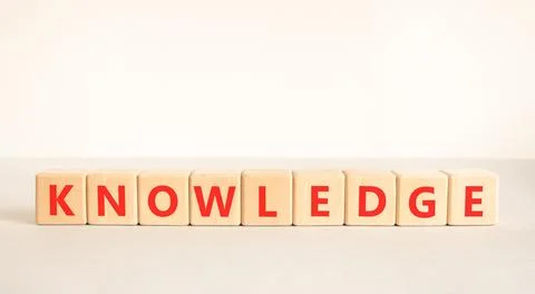Knowledge symbol. Concept word Knowledge on beautiful wooden blocks. Beauti.. Stock Photos